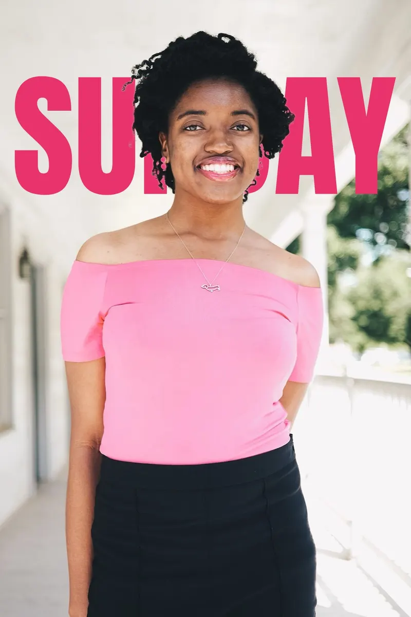 Portrait of a smiling woman with the word SUNDAY in pink Anton letters behind her head